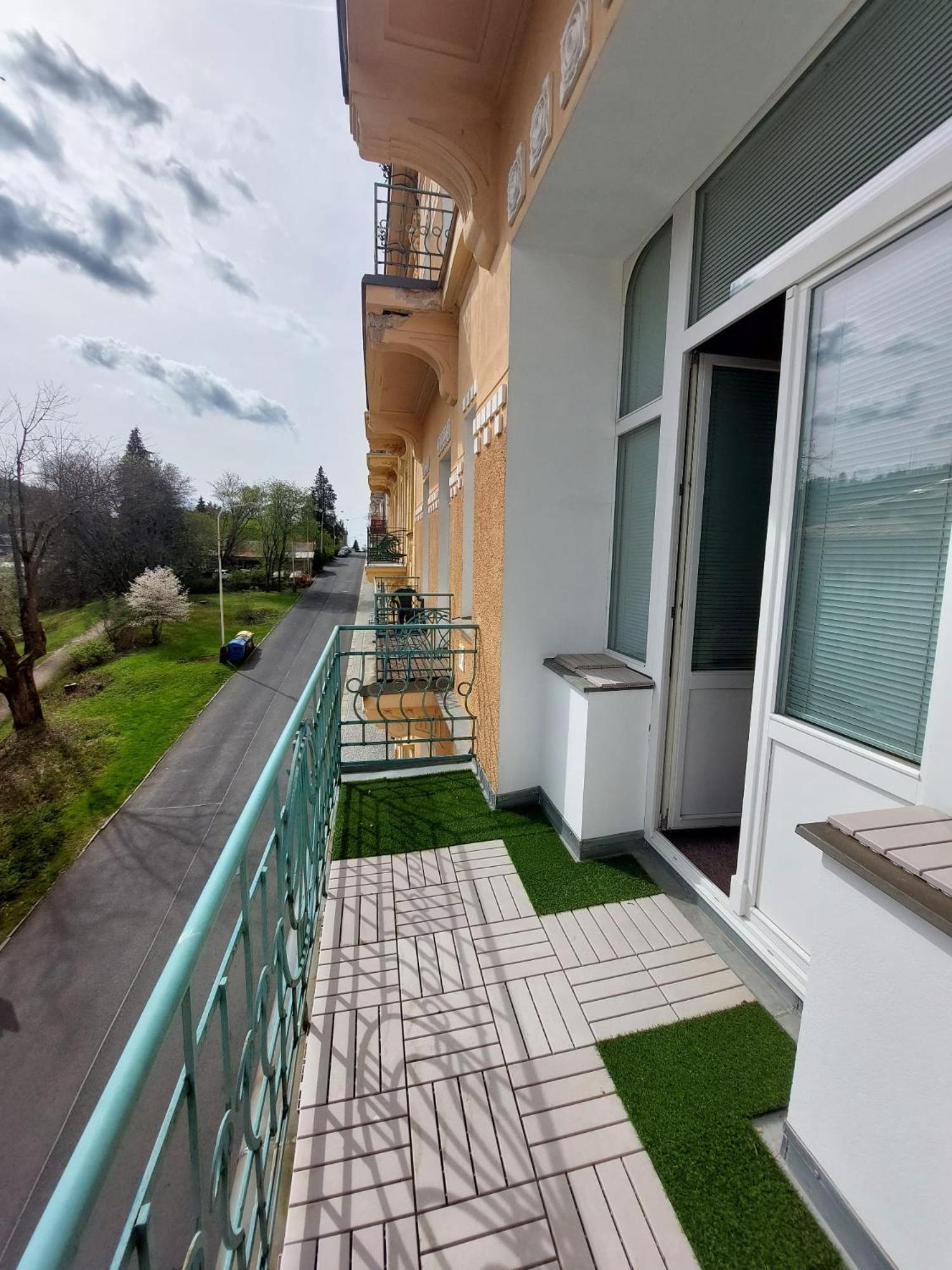 Balconies Above Colonnade Apartment